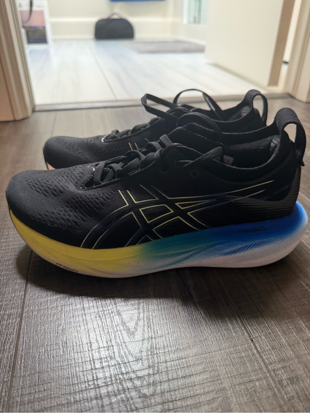 ASICS Black Men's Running Shoes with Yellow and Blue Gradient Midsole